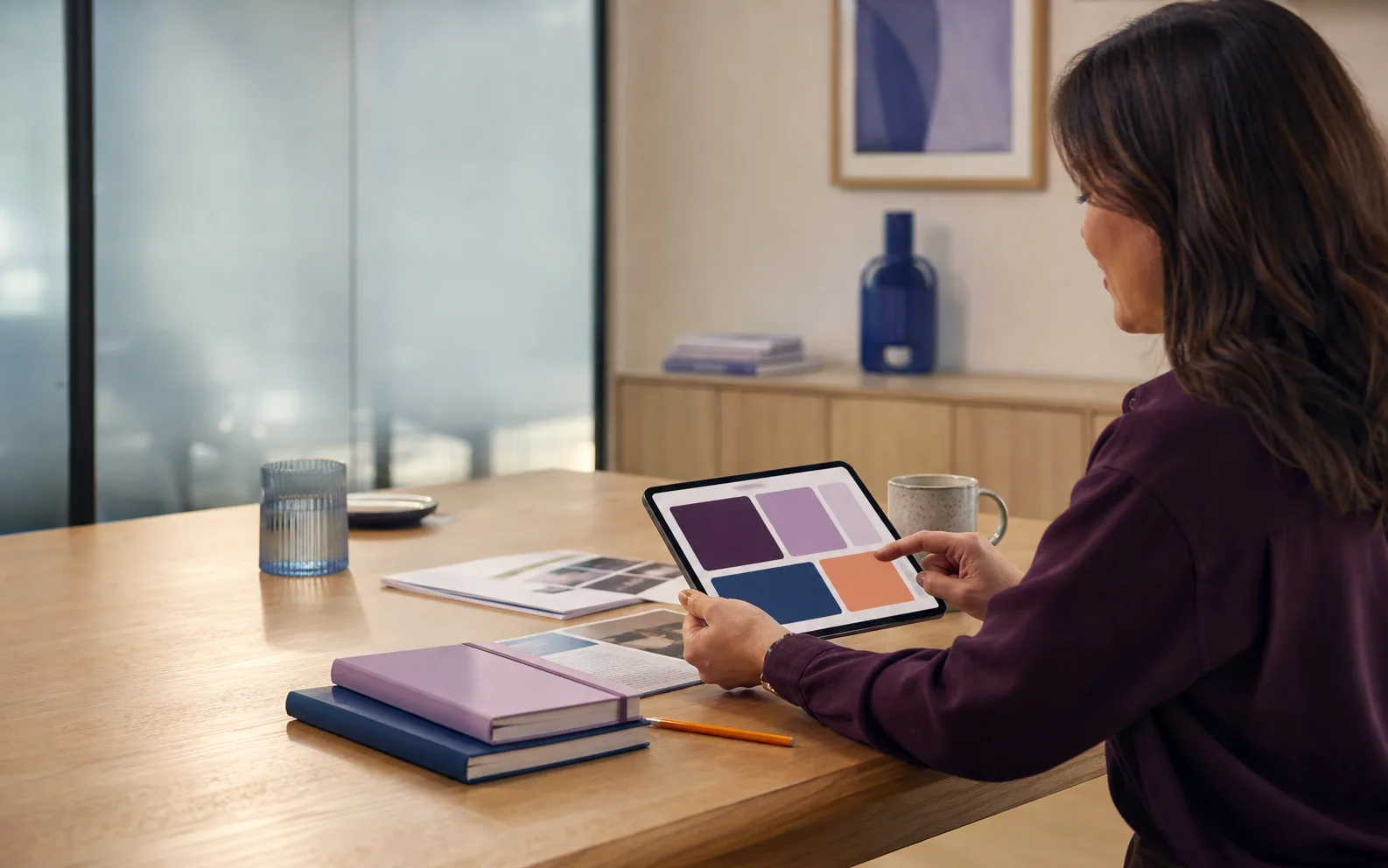 A care professional using a digital record in a calm, practical setting