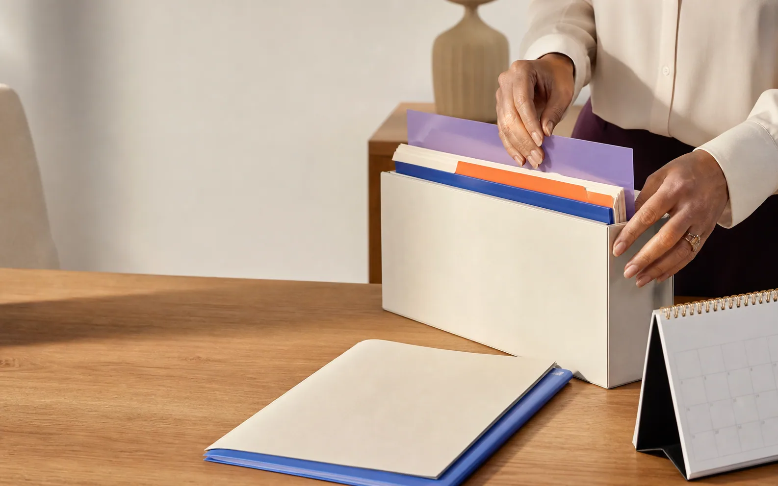 A prepared care-provider workspace with registration documents and practical planning materials