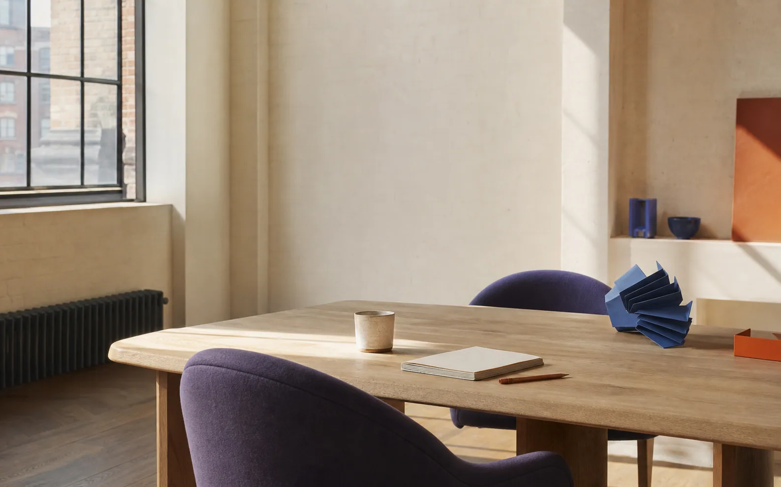 A welcoming studio table prepared for a focused conversation